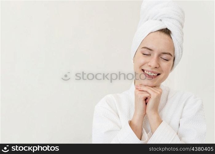 woman posing bathrobe smiling with copy space