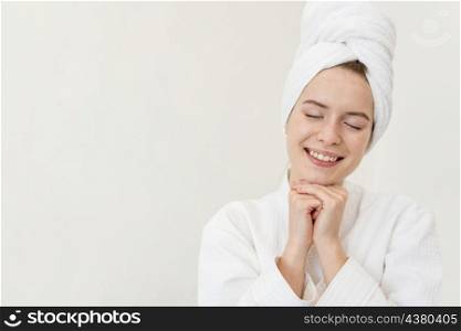 woman posing bathrobe smiling with copy space