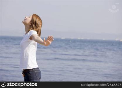 woman posing by sea