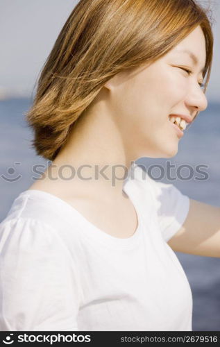 woman posing by sea