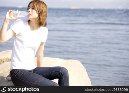 woman posing by sea