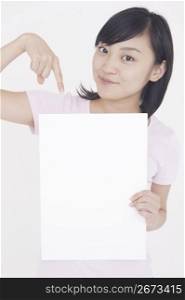 woman posing for camera with whiteboard