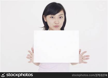 woman posing for camera with whiteboard