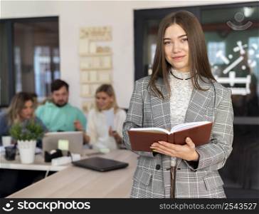 woman posing her coworkers