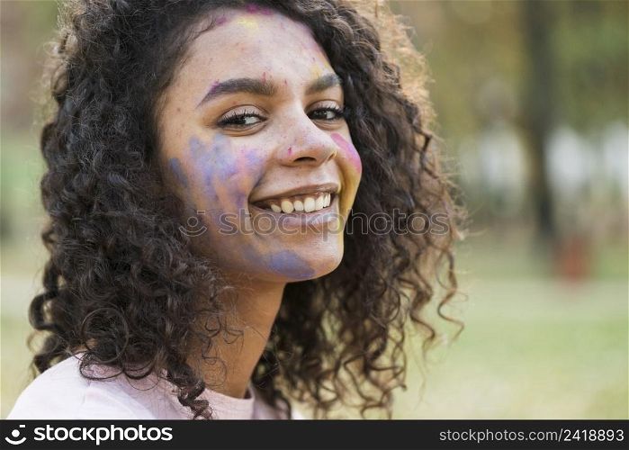 woman posing holi festival with beautiful smile
