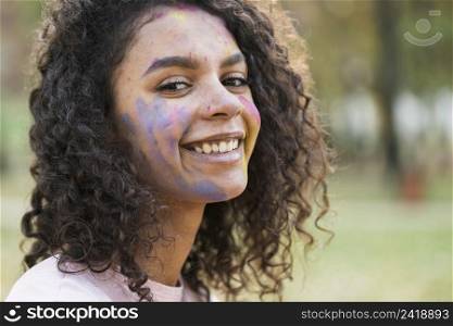 woman posing holi festival with beautiful smile