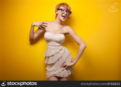Woman posing in glasses.