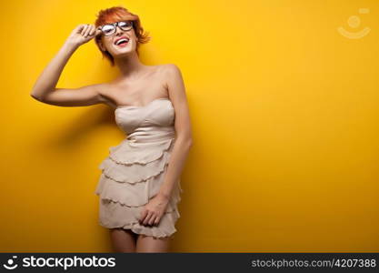 Woman posing in glasses.