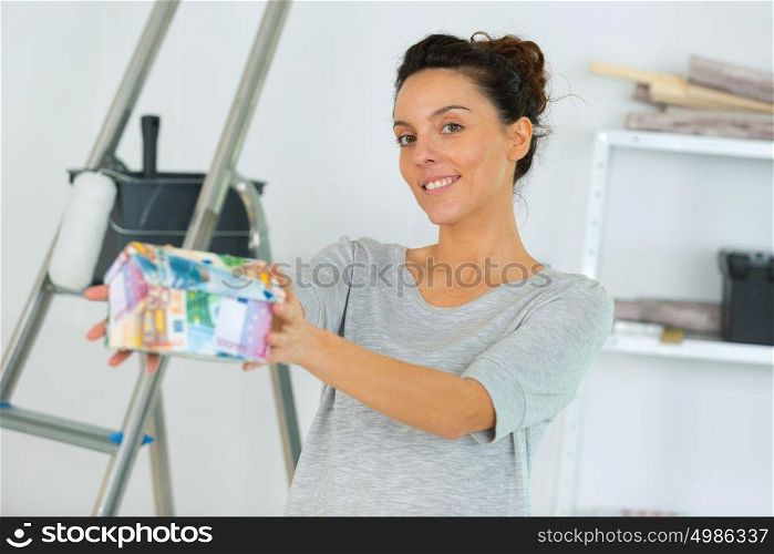 woman posing next to a ladder