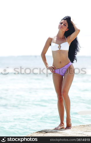 Woman posing on beach