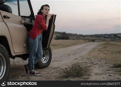woman posing while traveling alone by car