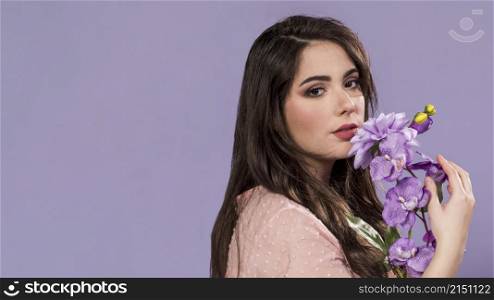 woman posing with bouquet flowers with copy space