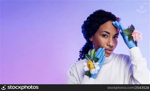 woman posing with floral gloves copy space