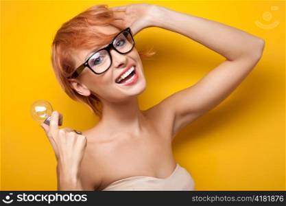 Woman posing with lightbulb.