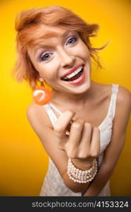 Woman posing with lollypop.