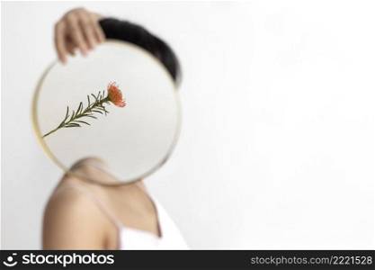 woman posing with mirror