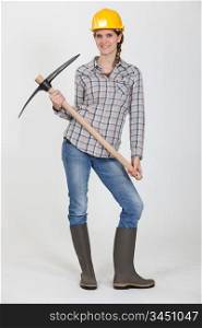 Woman posing with pick-ax