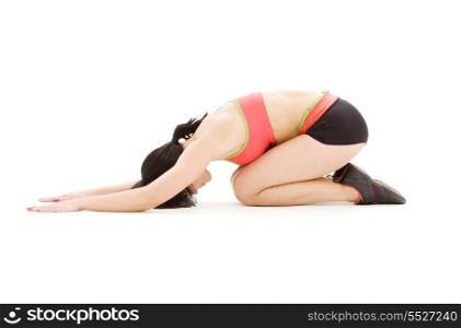 woman practicing ashtanga yoga posture over white