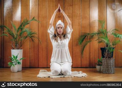 Woman practicing Kundalini Yoga, Kriya exercises for the navel center and bowel waste elimination  . Kundalini Yoga for The Navel Center and Waste Elimination System