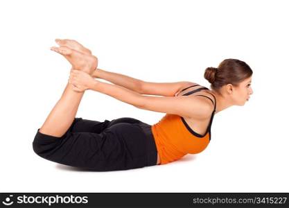 Woman practicing yoga exercise called Bow Pose sanskrit name: Dhanurasana, this pose improves posture, rejuvenates the spine, enhancing blood circulation, stretches ankles, thighs and groins, abdomen, chest, throat, and deep hip flexors, strengthens back muscles