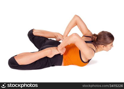 Woman practicing yoga exercise called Frog Pose, sanskrit name: Bhekasana, this pose stretches ankles, thighs and groins, abdomen and chest, throat, and deep hip flexors, strengthens the back muscles