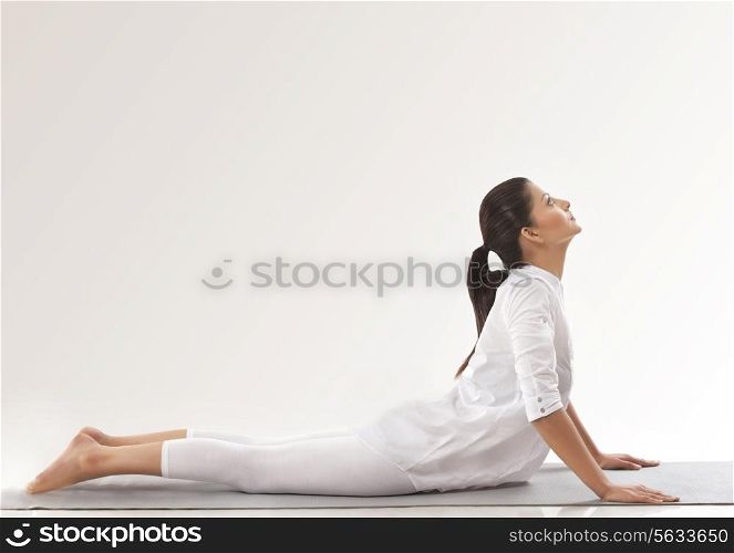 Woman practicing yoga - upward dog