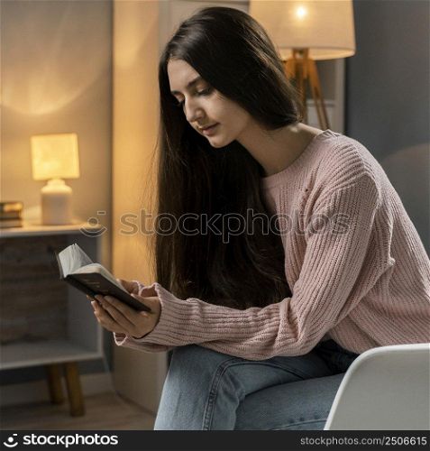woman praying while reading bible