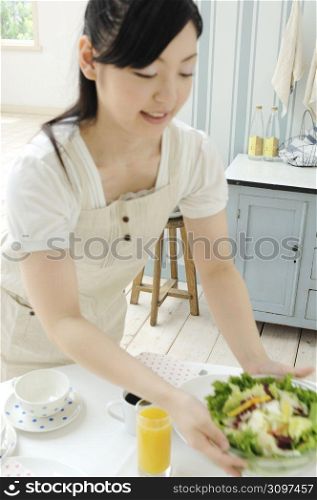 Woman preparing for the meal