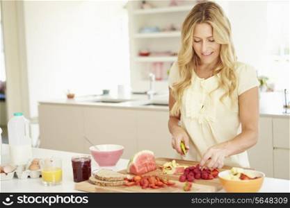 Woman Preparing Healthy Breakfast In Kitchen