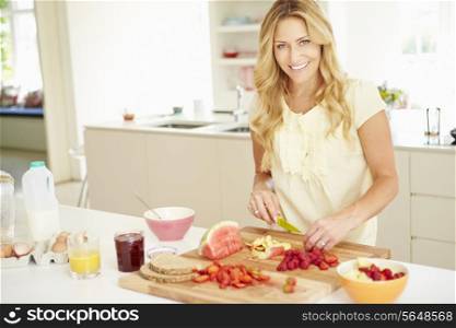 Woman Preparing Healthy Breakfast In Kitchen