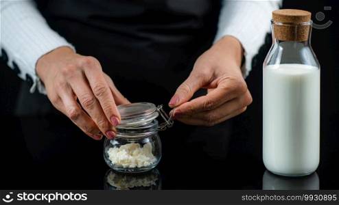 Woman Preparing Homemade Kefir, a Fermented Dairy Drink