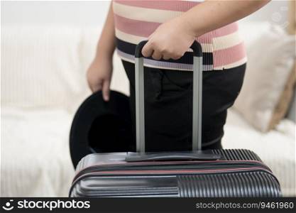 Woman preparing luggage  packing in suitcase  trolley luggage traveling alone solo girl