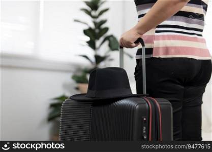 Woman preparing luggage  packing in suitcase  trolley luggage traveling alone solo girl