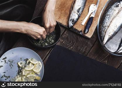 Woman preparing marinade for fish