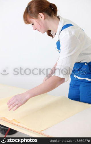 Woman preparing new wallpaper