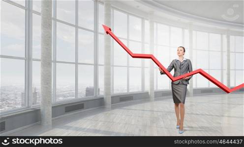 Woman presenting growth concept. Attractive businesswoman holding increasing graph in hands