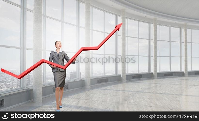 Woman presenting growth concept. Attractive businesswoman holding increasing graph in hands