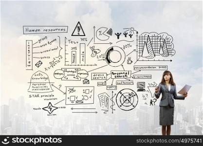 Woman presenting her business ideas. Young businesswoman drawing strategy plan on screen