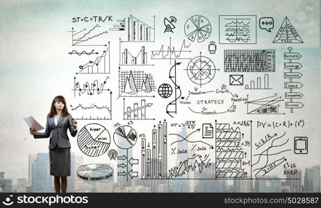 Woman presenting her business ideas. Young businesswoman drawing strategy plan on screen