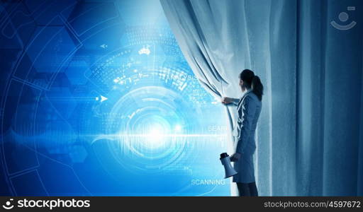Woman presenting technologies. Young businesswoman with megaphone opening curtain and presenting digital financial infographs
