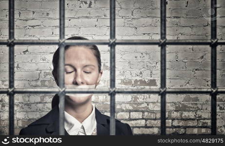 Woman prisoned in ward. Young speechless businesswoman in ward with tied hands and adhesive tape on mouth