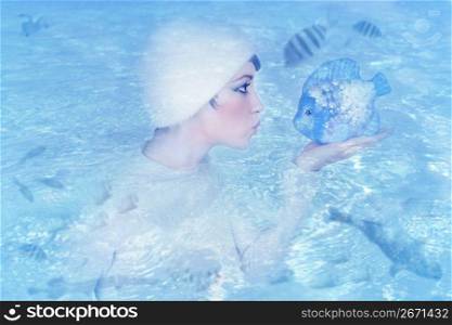 woman profile holding fish kissing expression blue water metaphor