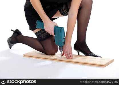 Woman provocatively using drill