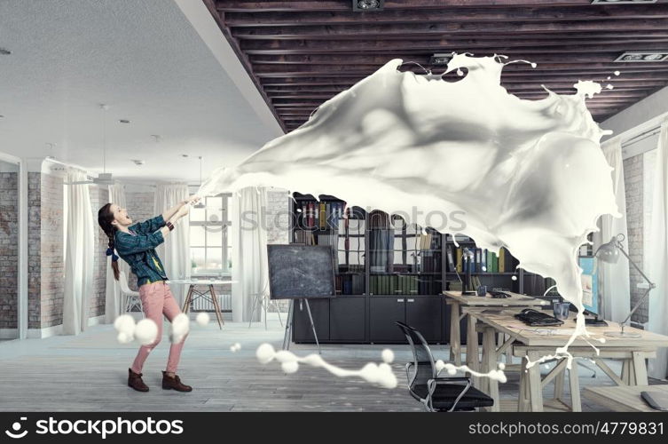 Woman pull white fabric. Young woman in office interior pulling white blank fabric