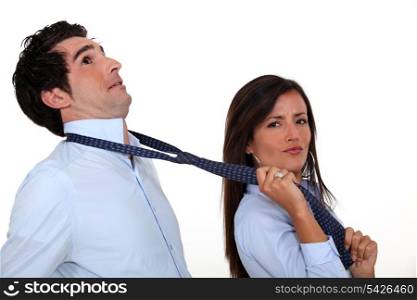 Woman pulling on boyfriend&rsquo;s tie