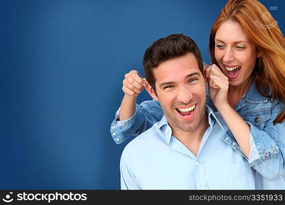 Woman pulling on her boyfriend&acute;s ears