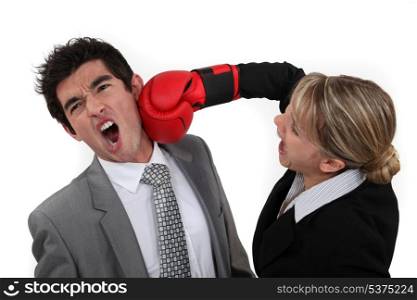 Woman punching her colleague