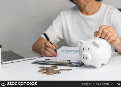 woman putting coin into piggy bank and saving money for future plan and retirement fund concept.