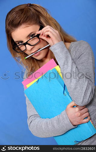 Woman putting on her glasses