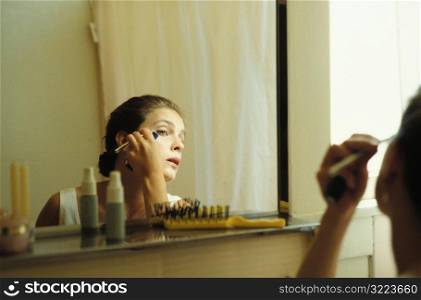 Woman Putting on Makeup